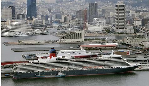 A large cruise ship docked in a harbor.